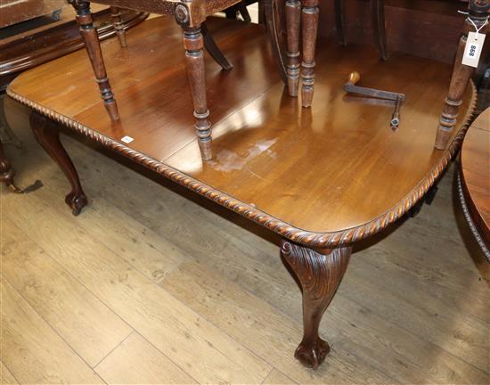 A 1930s Chippendale style carved mahogany extending dining table, on claw and ball feet Extended 160cm